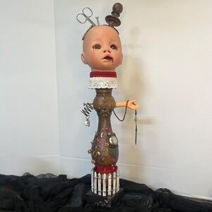 Creepy doll with scissors and key‎